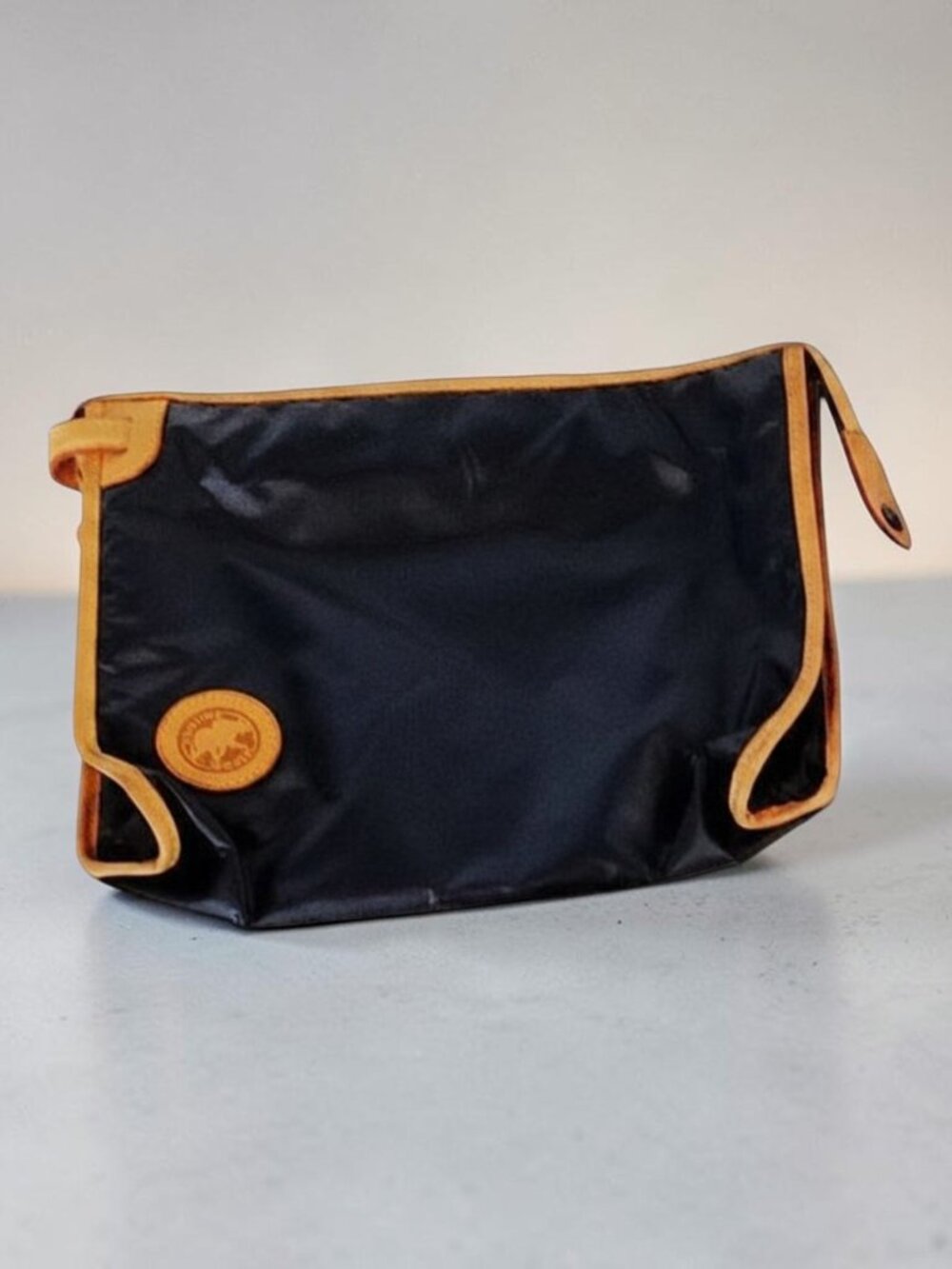 Hunting World clutch bag, made in Italy. Black color with brown trim.